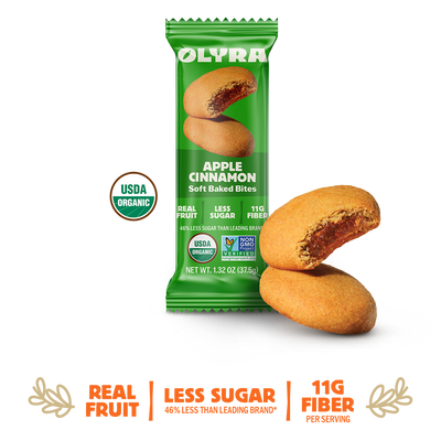 Green package of Olyra Apple Cinnamon soft baked bites on a white background