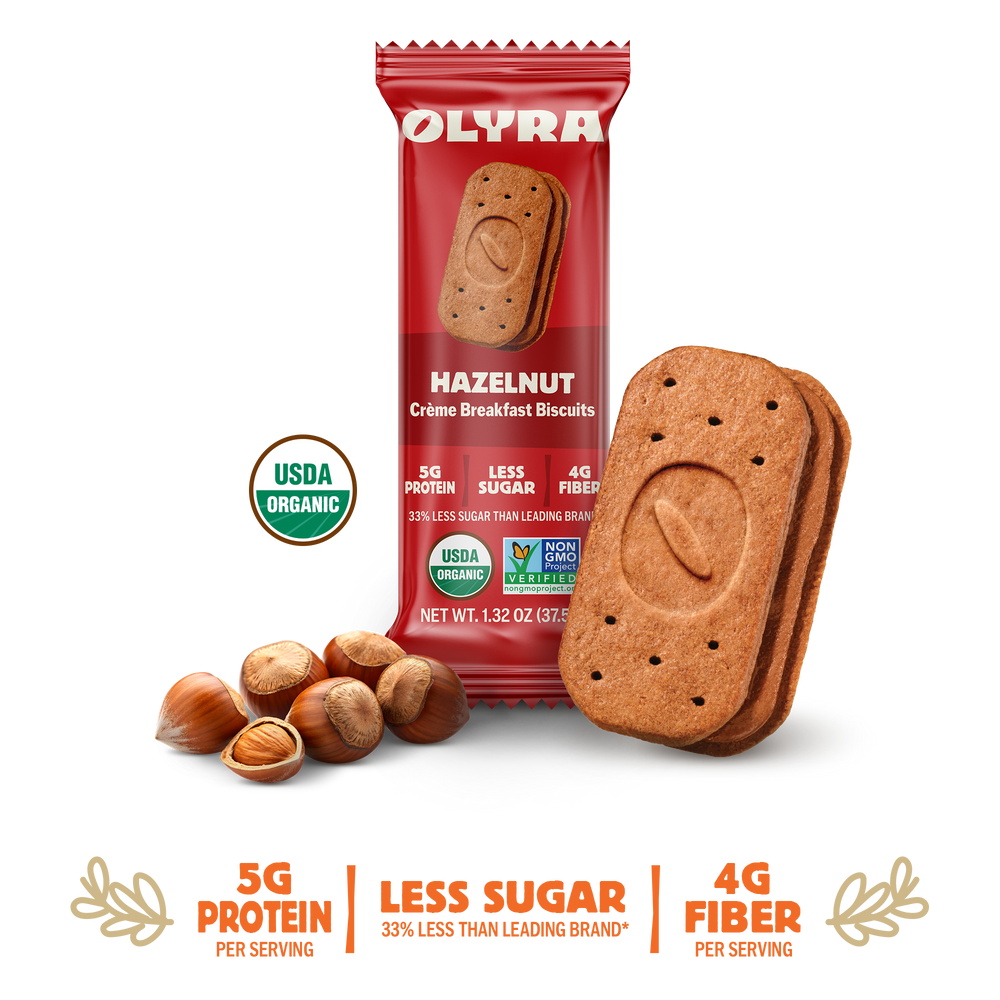 Olyra hazelnut cookies with packaging and nuts on a white background