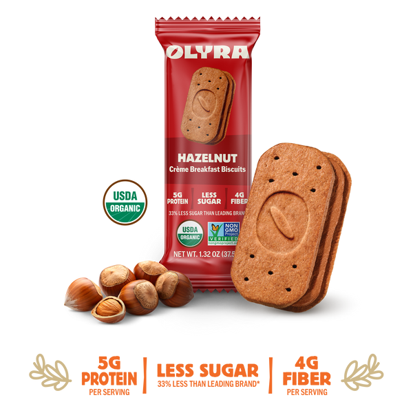 Olyra hazelnut cookies with packaging and nuts on a white background