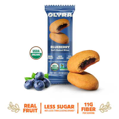 Olyra Blueberry Soft Baked Bites packaging with cookies and blueberries on a white background
