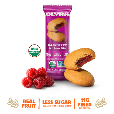 Olyra raspberry soft baked bites packaging with cookies and raspberries on a white background