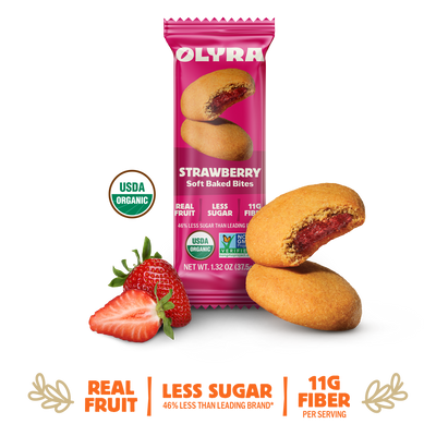 Olyra Strawberry Soft Baked Bites packaging with cookies and strawberries on a white background