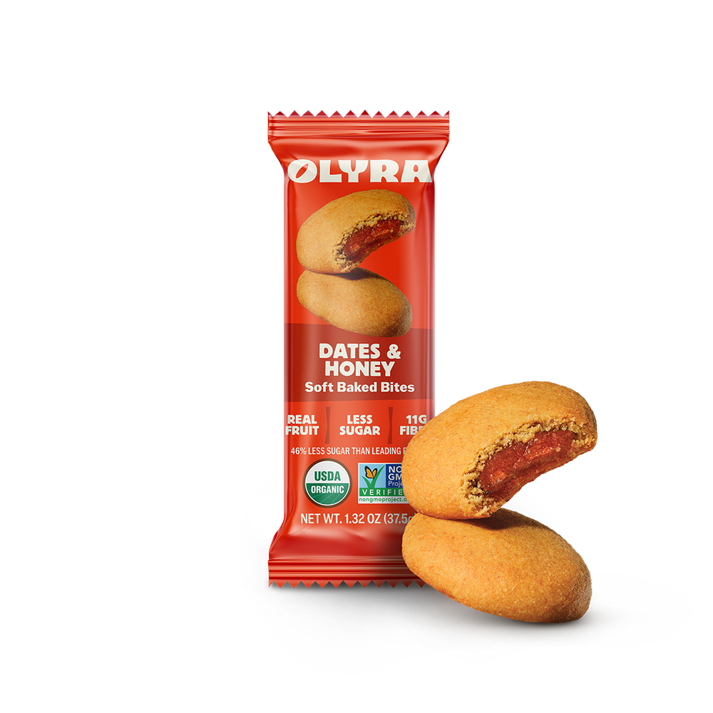 Olyra Dates & Honey soft baked bites packaging with two bites on a white background