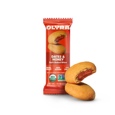 Olyra Dates & Honey soft baked bites packaging with two bites on a white background