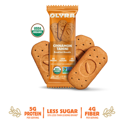 Olyra Cinnamon Tahini breakfast biscuits packaging with cookies on a white background