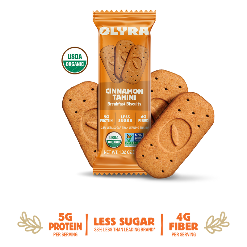 Olyra Cinnamon Tahini breakfast biscuits packaging with cookies on a white background