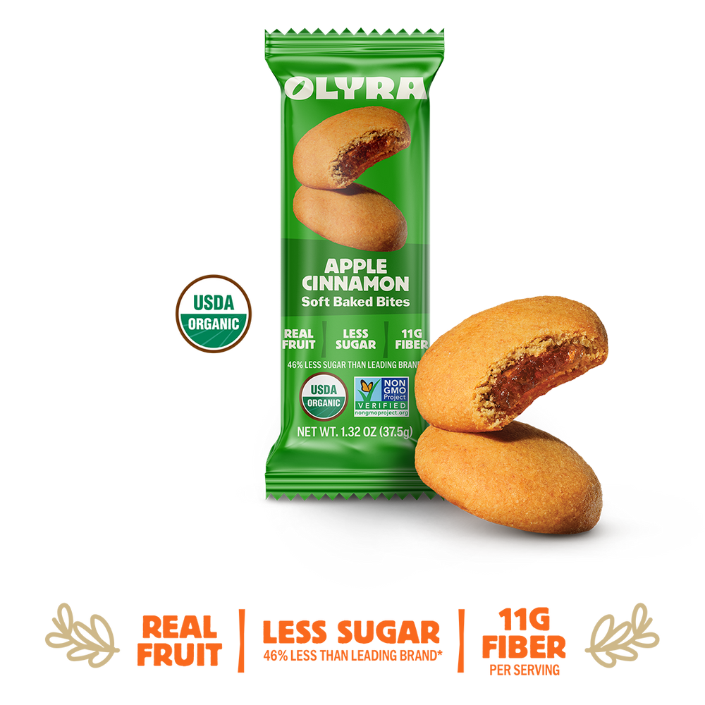 Green package of Olyra Apple Cinnamon soft baked bites on a white background