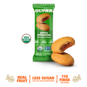 Green package of Olyra Apple Cinnamon soft baked bites on a white background